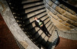© IVASHstudio - young and handsome groom in a black suit lying on the stairs