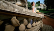 © IVASHstudio - young and beautiful bride in white dress standing on the stairs