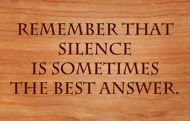 Remember that silence is sometimes the best answer - an old saying on wooden red oak background