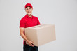 © Drobot Dean - Side view of delivery man with box