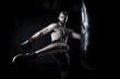 © Dewald - Male Athlete boxer punching a punching bag with dramatic edgy li
