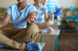 © Africa Studio - Schoolchildren in lotus position relaxing on lesson
