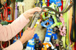 Hands of woman selecting lead in pet shop, close up view