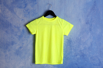 Blank bright t-shirt on grunge background