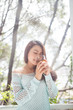 © makistock - Portrait of a young asian woman drinking her morning tea. Fell r
