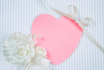 Wall Mural - boutonniere, pink heart shaped tag, white silk ribbon
