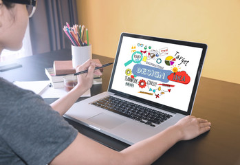 Wall Mural - business women using on computer laptop with web design website homepage ideas programming concept.