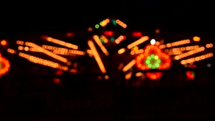 Wall Mural - Blurred Amusement park ride at night.
