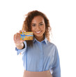 © Africa Studio - Young woman with gift card on white background. Holiday celebration concept.