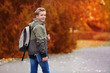 © Africa Studio - Cheerful teenager walking in autumn park