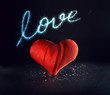 Big heart made of textured fabric with a beautiful light, sequins and neon inscription 