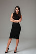 © Drobot Dean - Woman standing in fashion dress with arms folded