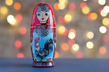 Rooster - a symbol of the New year. The picture on the doll matryoshka