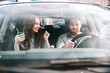 © Drobot Dean - Fashion portrait of couple in car