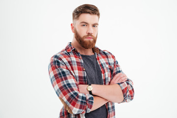 Wall Mural - Satisfied bearded man in plaid shirt with arms folded