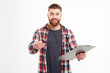 © Drobot Dean - Man in shirt holding clipboard and giving pencil to camera