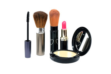 Closeup group of makeup cosmetics on white background.