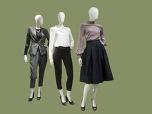 Three Female Mannequins Dressed With Fashionable Clothes.