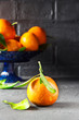 © giftulya - Tangerines on a black background, vertical, selective focus