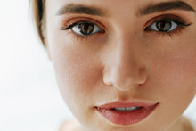 Closeup Of Beautiful Young Woman Face With Natural Makeup