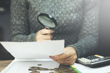 Wall Mural - woman hand document and magnifier