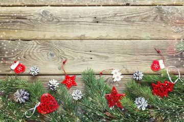 Christmas background with fir branches and decorations on old wo