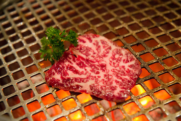 high quality a4 or a5 beef on steel grill in yakiniku restaurant