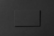 canvas print picture - Mockup of blank business card at black textured background.