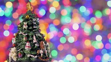 Decorated Christmas Tree Rotating On Blinking Bokeh Background.
