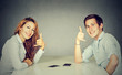 © pathdoc - Man and woman with call me hand gesture sitting at table