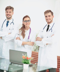 Wall Mural - Portrait of group of smiling hospital colleagues standing togeth