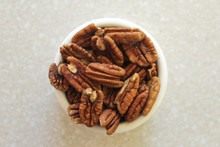 Pecans In A Container On A Kitchen Countertop, Centered