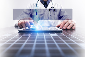 Medical doctor working with modern computer and pressing button with empty space for your text. Medical concept.