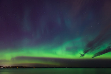 Wall Mural - Northern lights over lake in finland