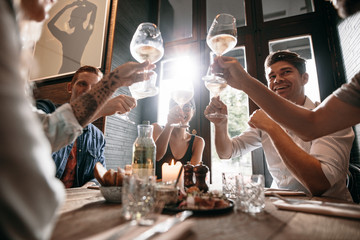 Group of young people making a toast