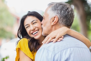 Close-up of man kissing woman