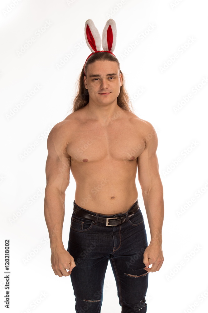 athlete bodybuilder shirtless with long hair posing with a rabbit-like ...