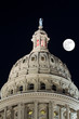 Texas Capitol on a full moon night in Austin.