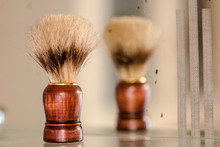 Old Brown Vintage Shaving Brush Reflects In Mirror