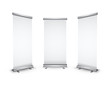 Three blank roll-up banners with shadow on white