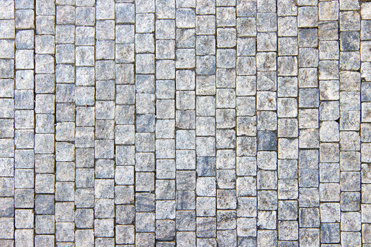 granite cobblestone pavement background, stone textured pattern
