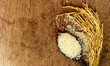 rice on wood wiht wooden spoon background