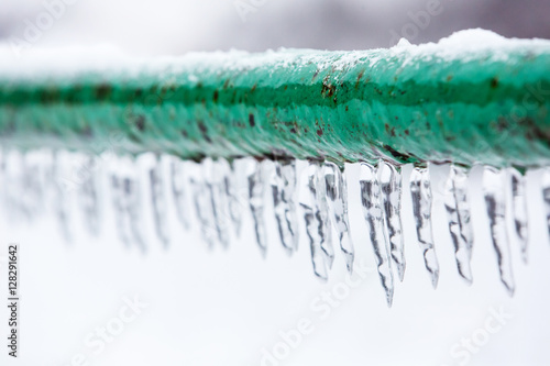 Fotografia  Frozen icy down pipe, icicles