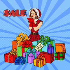 Wall Mural - Pop Art Woman in Santa Hat Blowing Snow on Christmas Sale. Vector illustration