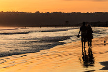 Silhouette Of Couple In Love In Golden Light On Beach In Coronado, California.