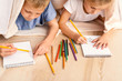© Yakobchuk Olena - Little boy and girl painting at home