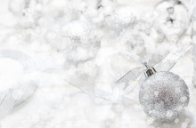 Silver Christmas Ball With Ribbon On White Spakles Bokeh Light B