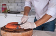 Chef cutting fresh salmon