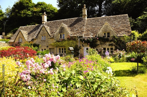 English Country Cottage In The Sunshine In Cotswolds England Uk