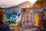 Fototapeta  - The Ruins of Taormina Theater at Sunset. Beautiful travel photo, colorful image of Sicily.